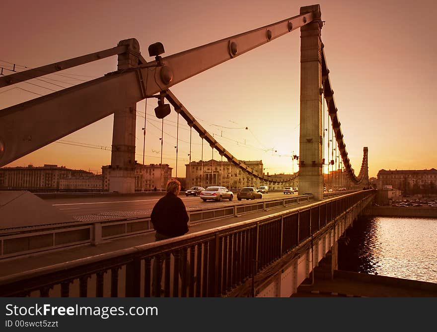 Solitary man on bridge