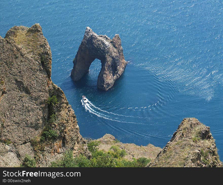 Walk on a boat near a rock  Golden Gate , Crimea, Кaradag