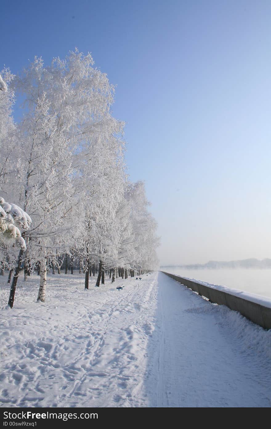 Fine winter landcape at quay , river is steaming. Fine winter landcape at quay , river is steaming