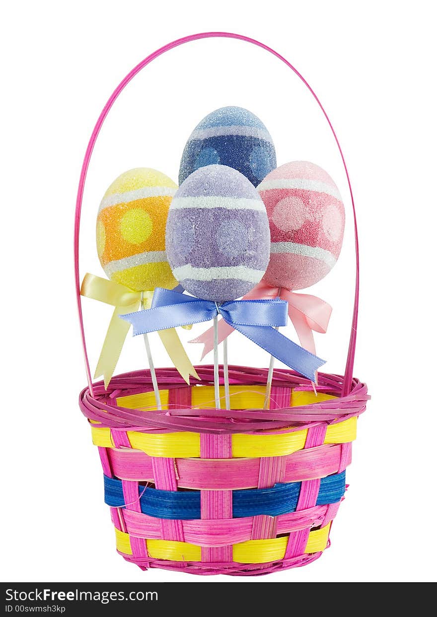 Easter basket with colored eggs in it, isolated on white. Easter basket with colored eggs in it, isolated on white