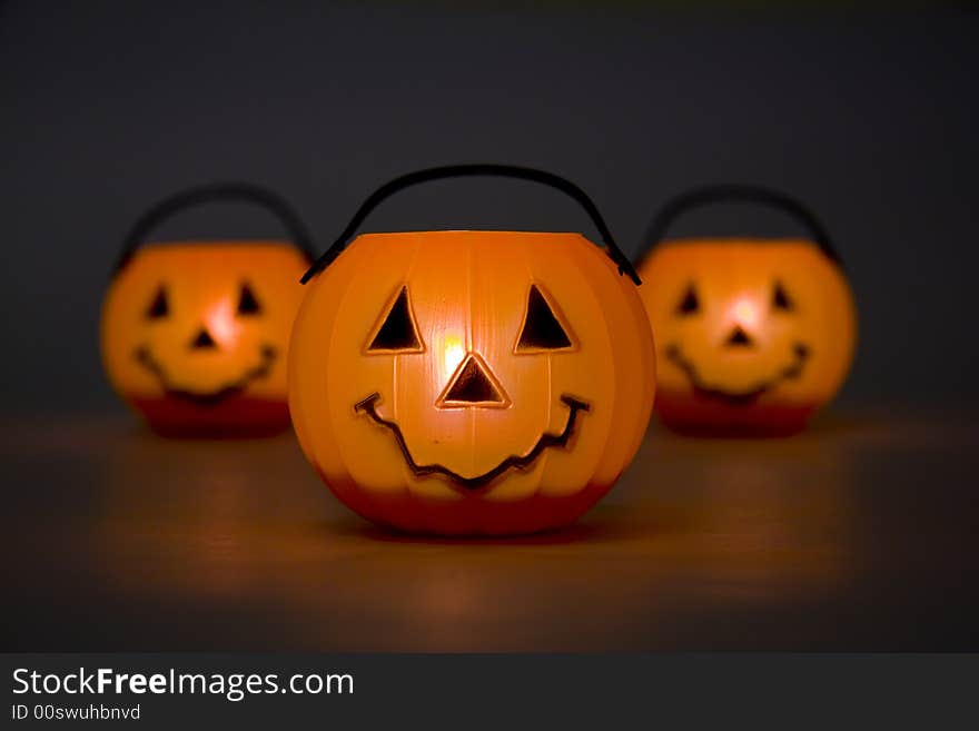 Horizontal image of lit jack-o-lanterns. Horizontal image of lit jack-o-lanterns