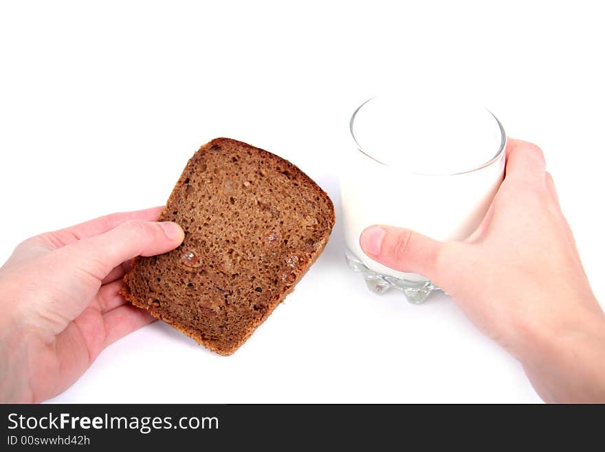 Bread and glass of milk. White background. Bread and glass of milk. White background.