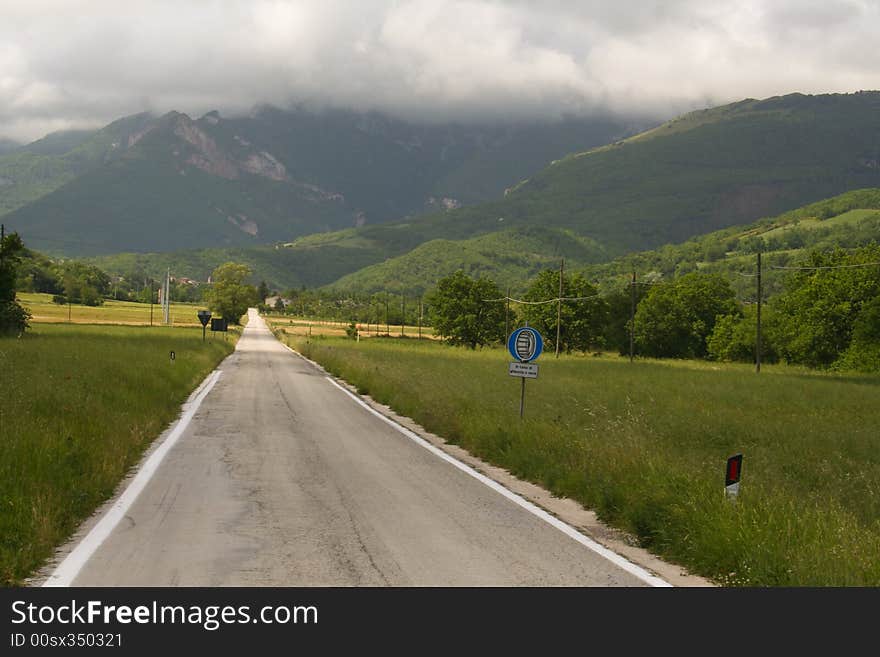 Road into the stormy mountain