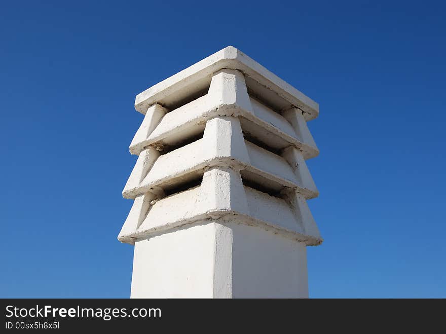 A cement funnel with sky as background. A cement funnel with sky as background