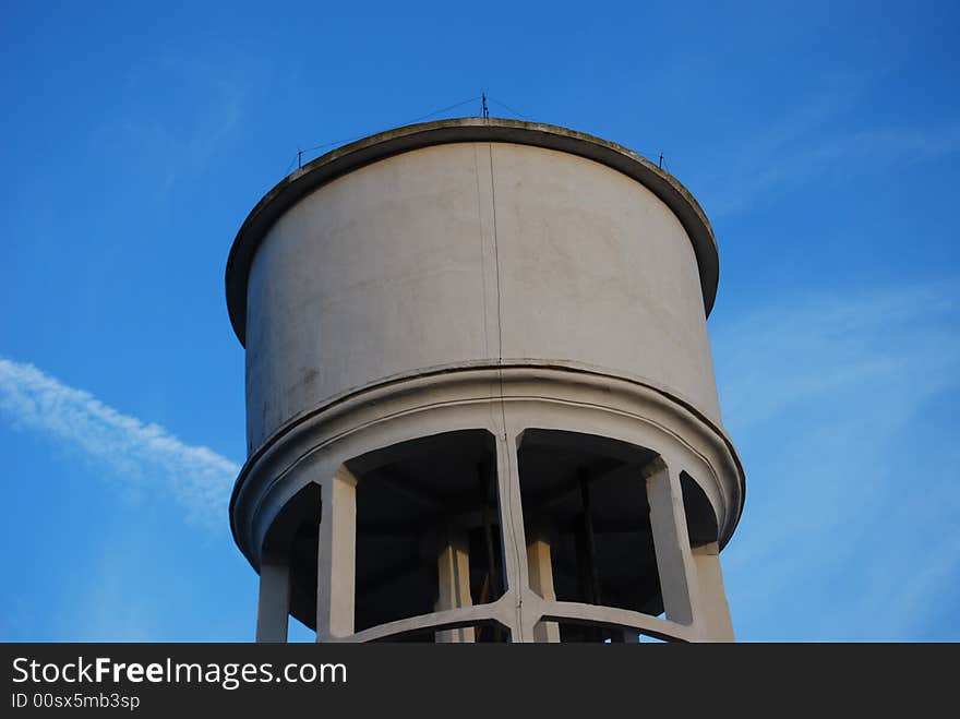 An aqueduct gravity tank with blue sky as background. An aqueduct gravity tank with blue sky as background