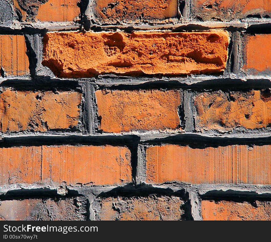 An old brick and mortar wall for backgrounds or texture. An old brick and mortar wall for backgrounds or texture