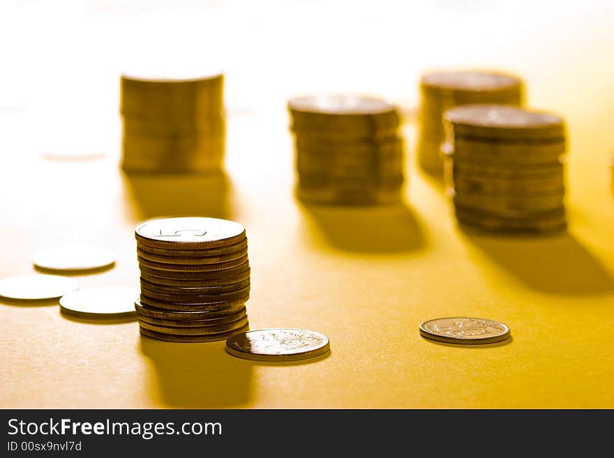 Money series: coins on the yellow background