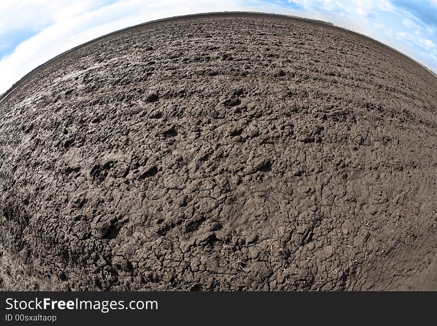 Agriculture theme: fish eye view of plough land