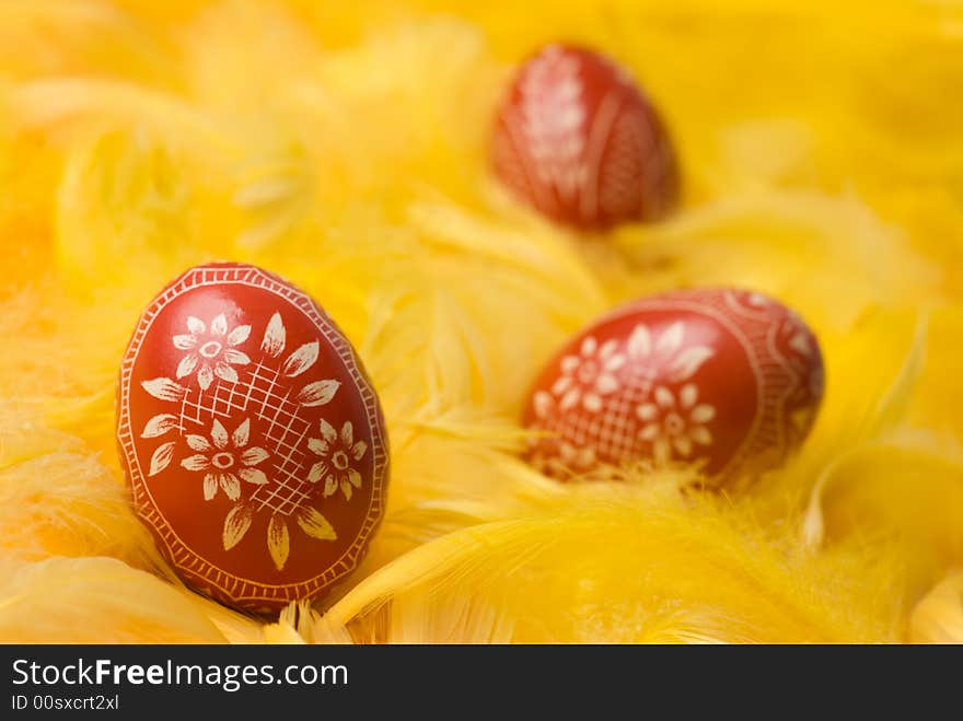 Three handmade easter eggs - selective focus on the first one. Three handmade easter eggs - selective focus on the first one.