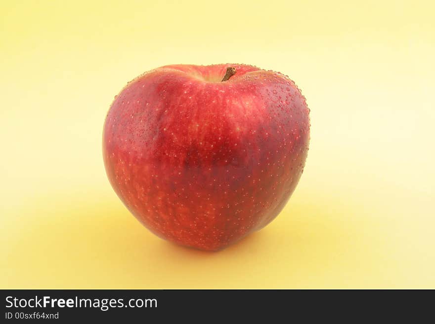 Red Apple on gradual yellow background