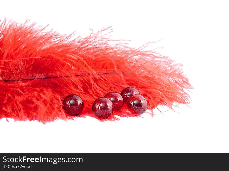 Red feather and marbles