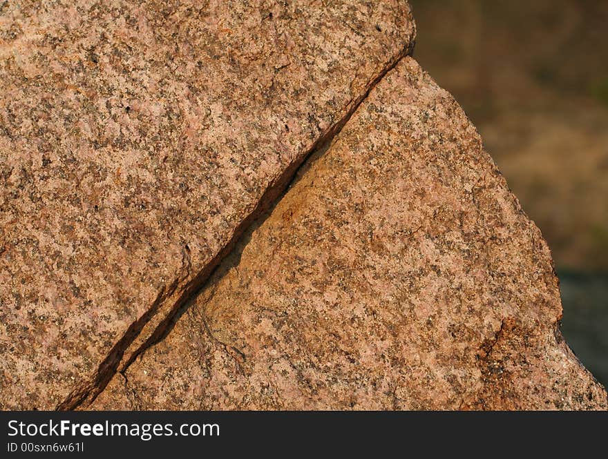 Natural granite rock that looks like an old man's face in a profile.