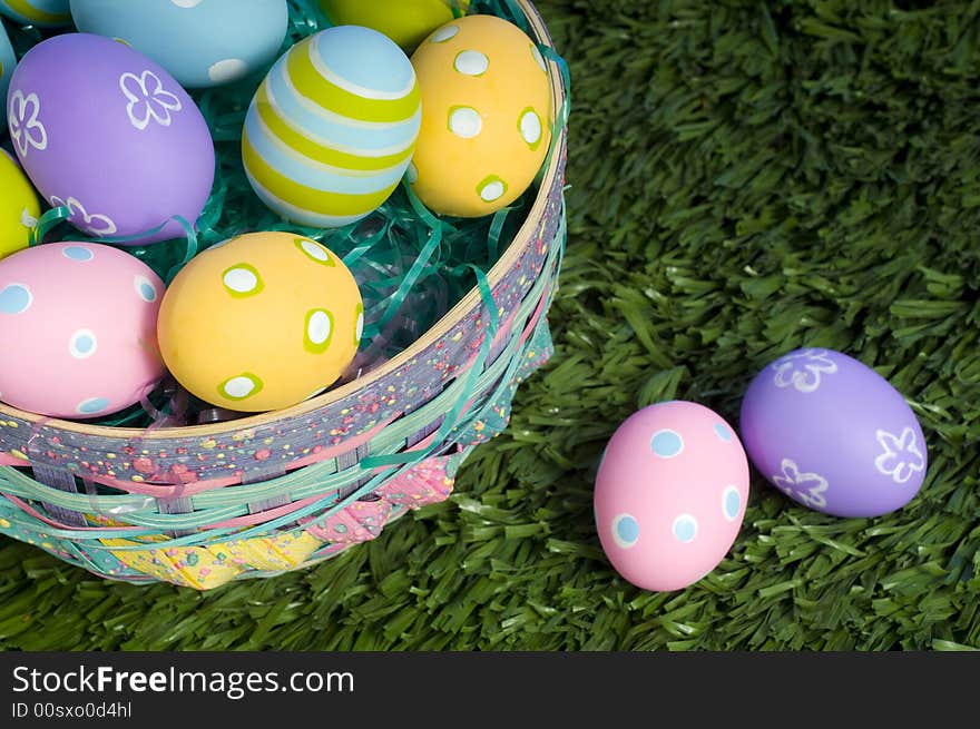 Brightly colored Easter eggs in a basket. Brightly colored Easter eggs in a basket