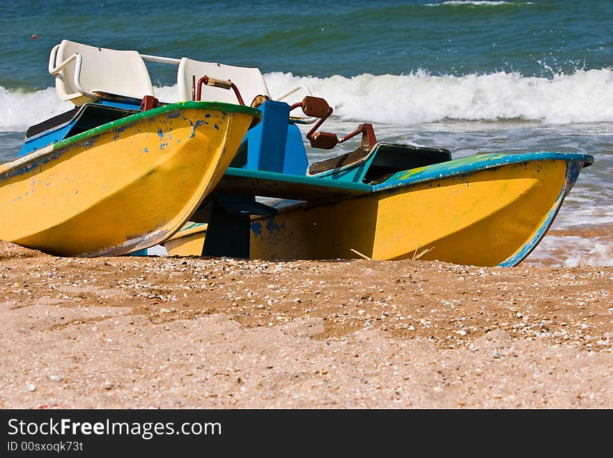 Leisure series: promenade catamaran on the beach of stormy sea. Leisure series: promenade catamaran on the beach of stormy sea