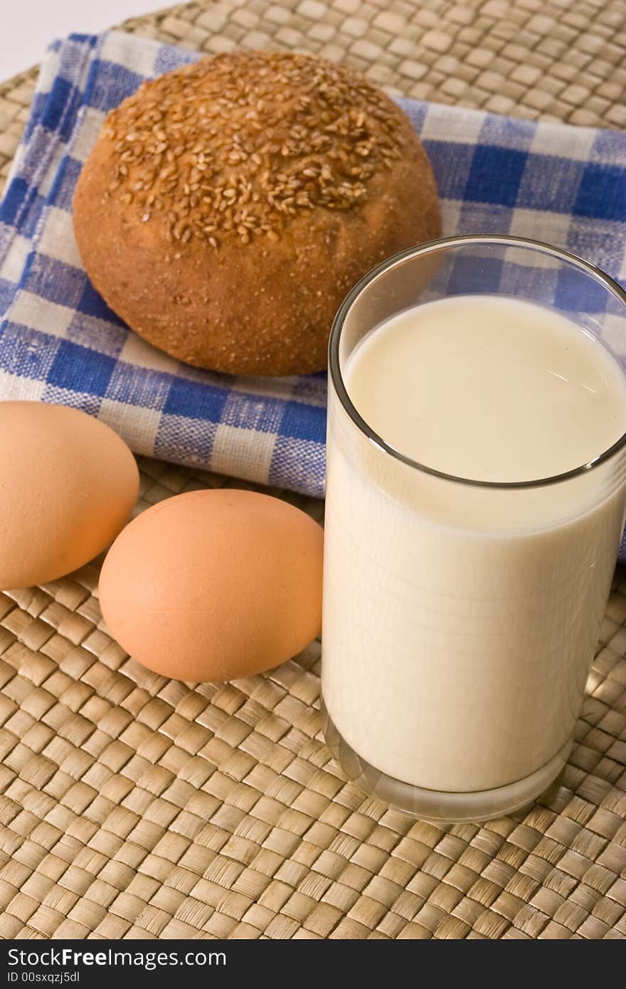 Light morning, milk with sweet bun and eggs