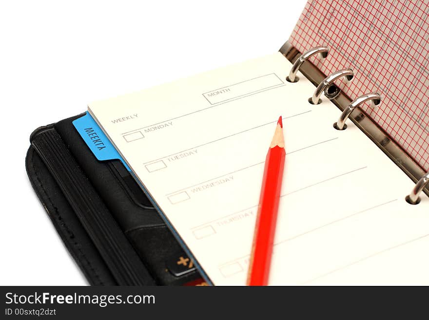 Open Black Organizer And Red Pencil