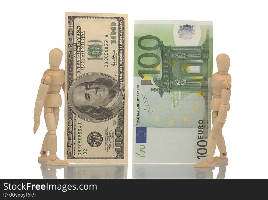 Manikins hold hundred euro and dollar bills. Manikins hold hundred euro and dollar bills