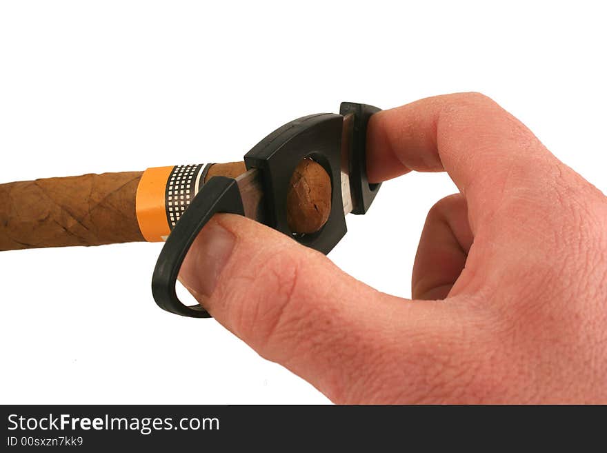 A Hand cutting a cigar on white background