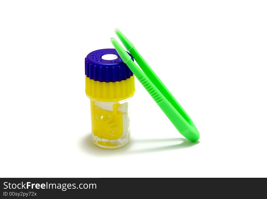 Many-colored contact lens accessories on white background