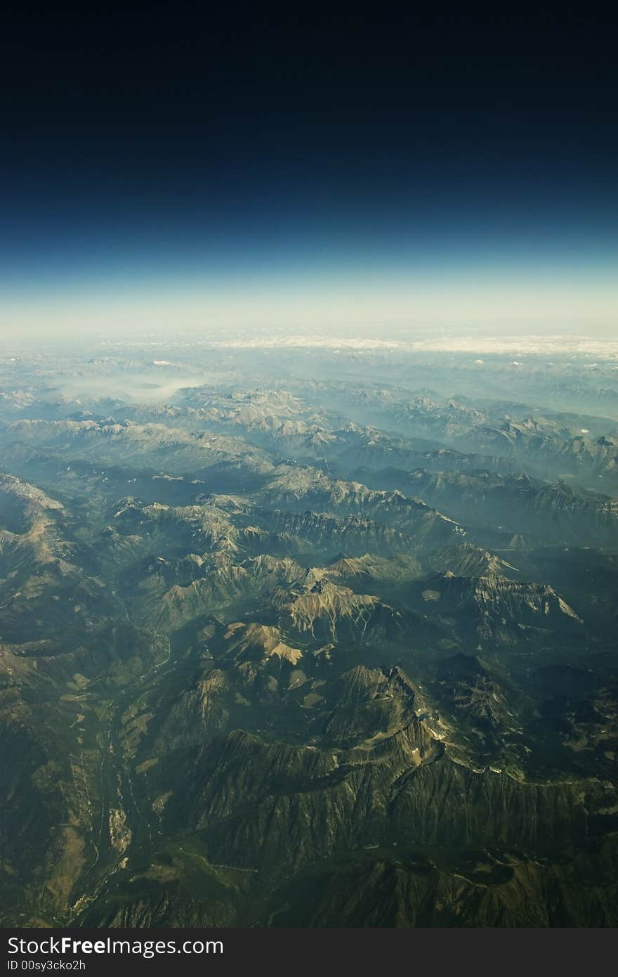 The Canadian Rockies seen from an airplane window. The Canadian Rockies seen from an airplane window.