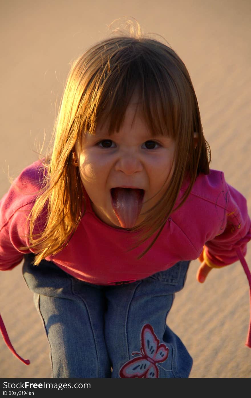 Little Girl shouting at the camera.