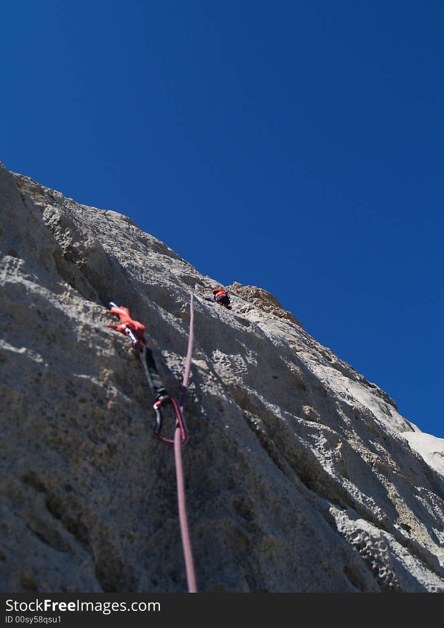 Climber leads second pitch on east face of Picu Urriellu