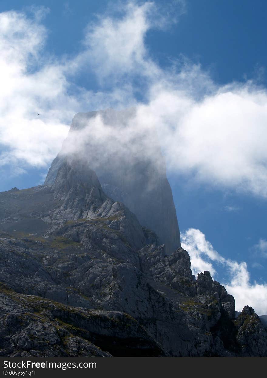 Silhouette of Picu Urriellu in clouds