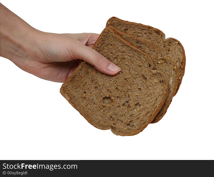 Hand holding three slices of cereal bread