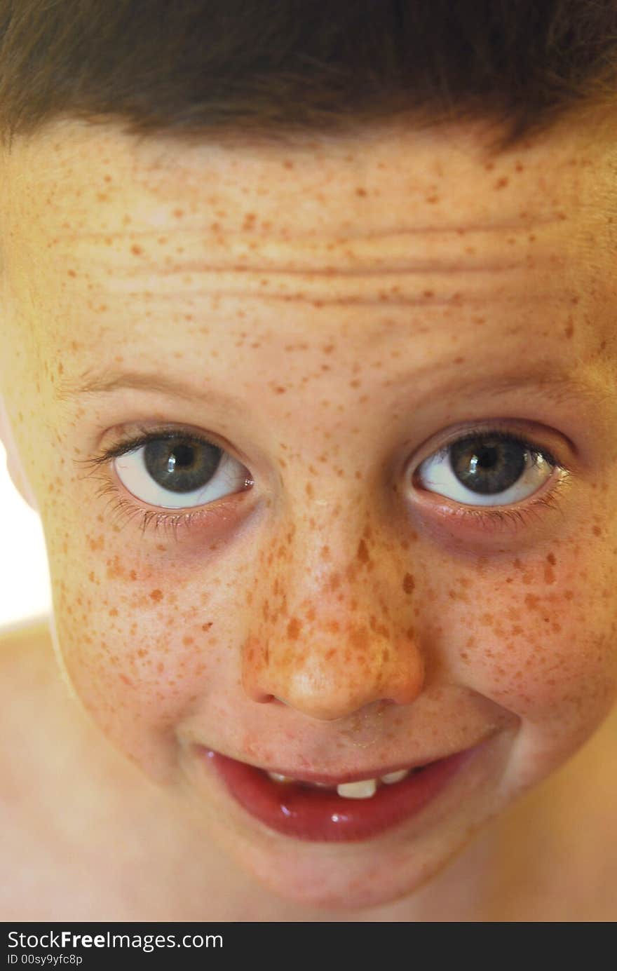 Freckled faced boy with snot and a smile. Freckled faced boy with snot and a smile