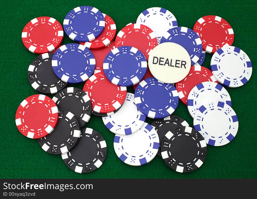 Colorful gambling chips over a green table. Colorful gambling chips over a green table