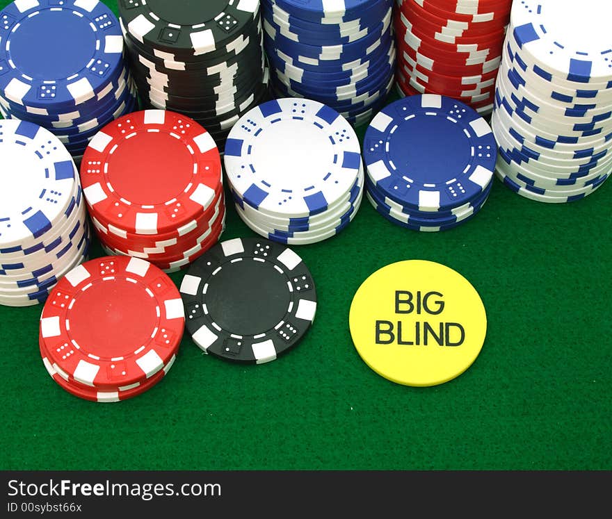 Several piles of gambling chips over a green table. Several piles of gambling chips over a green table