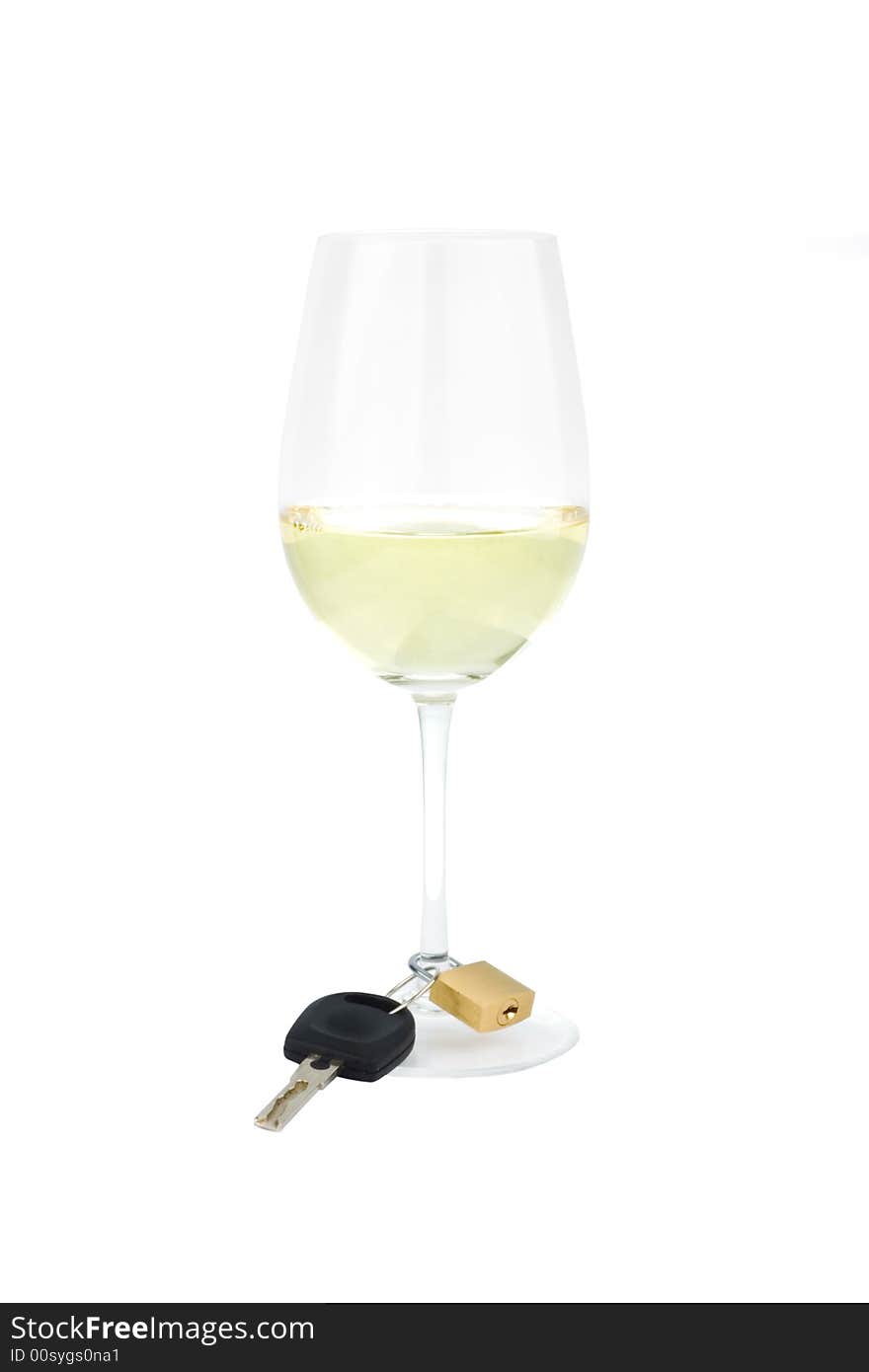 Shot of a wine glass against white with a car key locked to the glass stem as a wine charm. Shot of a wine glass against white with a car key locked to the glass stem as a wine charm.