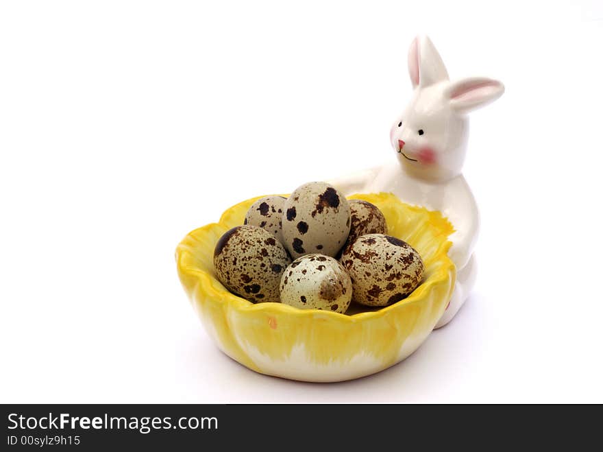 Quail eggs on bunny tray with white background