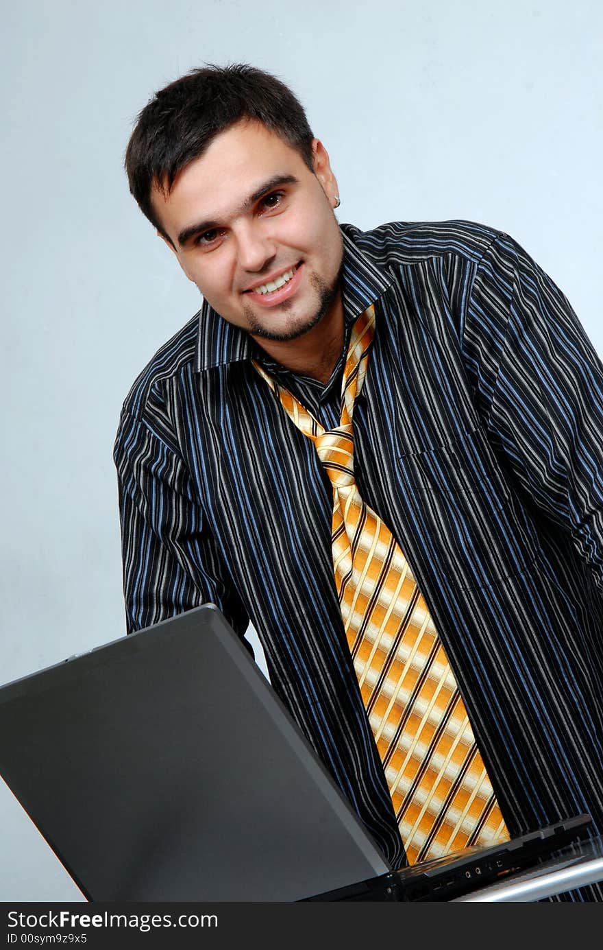 Young businessman with laptop computer