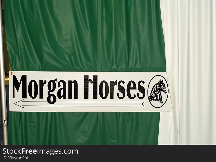 Sign at horse expo pointing to Morgan Horses. Sign at horse expo pointing to Morgan Horses.