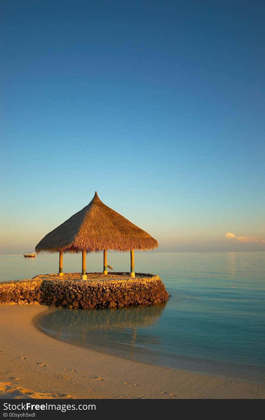 Tropical beach at sunrise on maldives