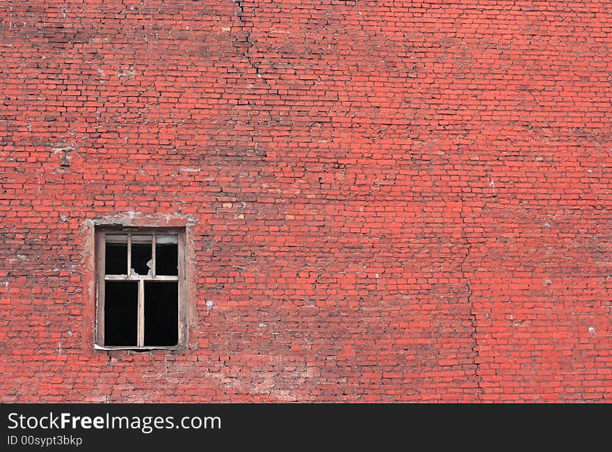 Old urban brick wall with destroyed window. Old urban brick wall with destroyed window.