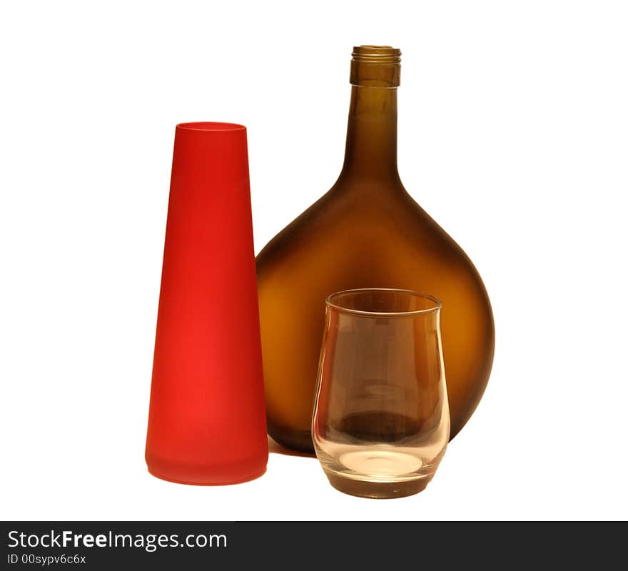 Brown wine bottle and glass isolated on a white background