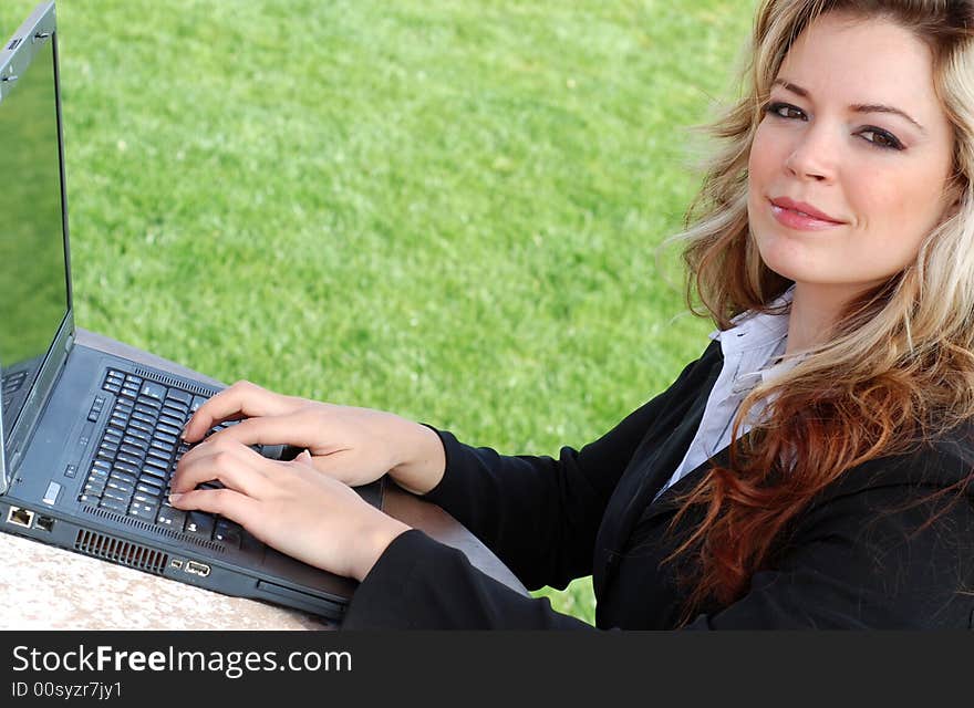 Portrait of a confident and successful businesswoman with a laptop. Portrait of a confident and successful businesswoman with a laptop