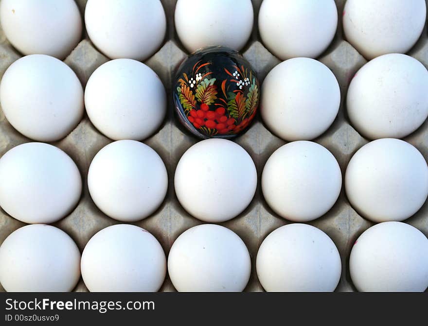 Background of eggs group with one painted egg. Background of eggs group with one painted egg