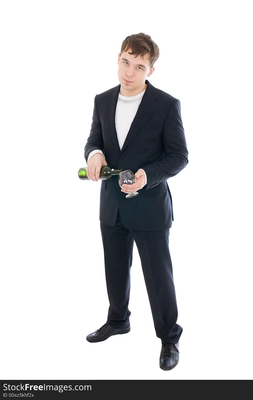 The young businessman with a bottle of wine isolated on a white background. The young businessman with a bottle of wine isolated on a white background