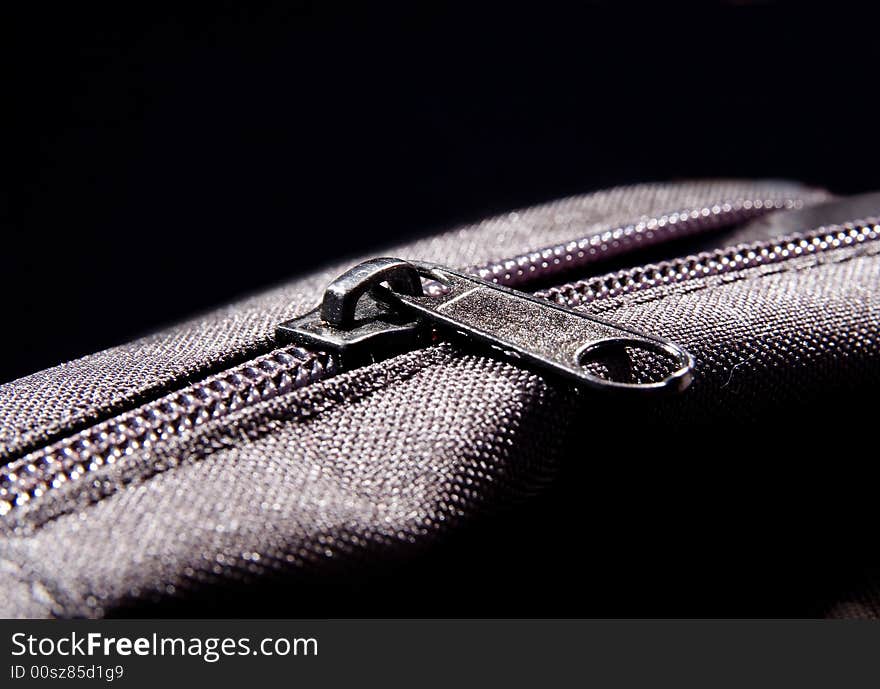 Nylon metal textile zipper on the bag macro