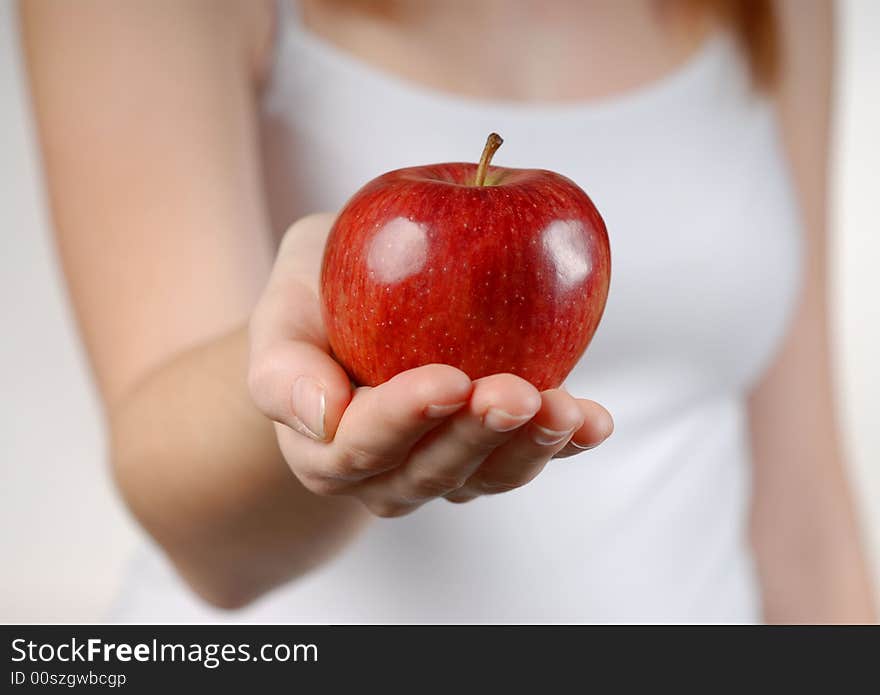 Red apple on beautiful female hand. Red apple on beautiful female hand