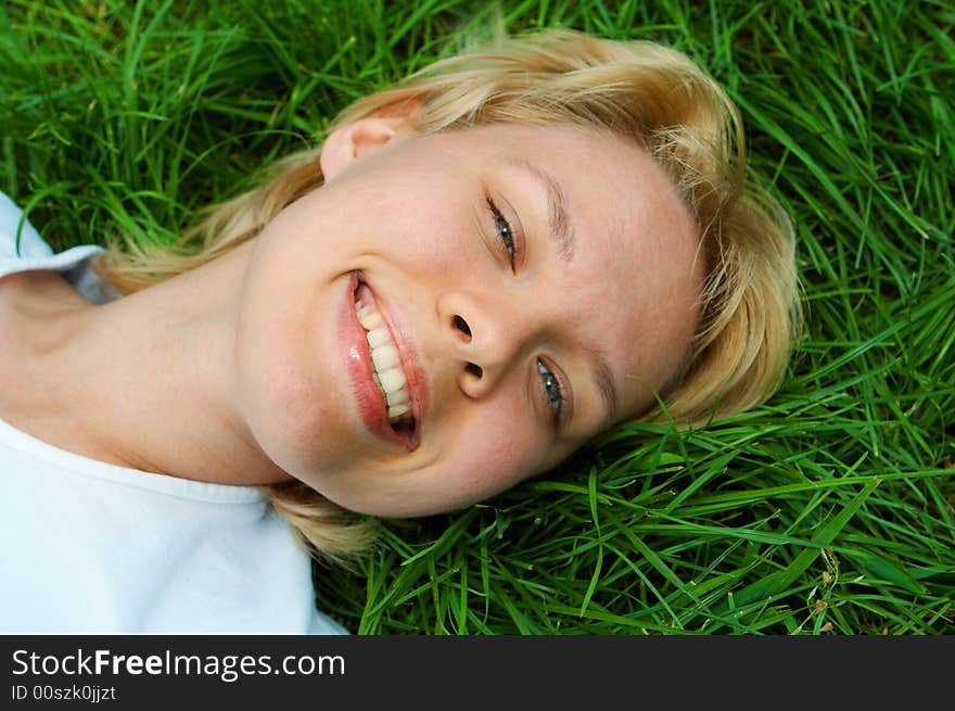 Woman lie on green grass. Woman lie on green grass