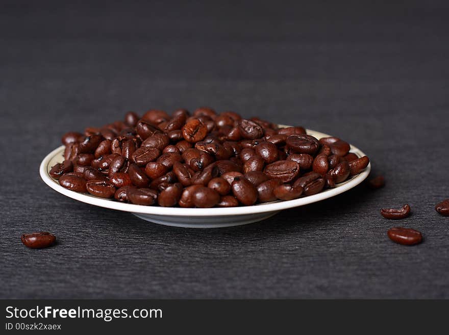 A mineral deposit of coffee is falling coffee grains