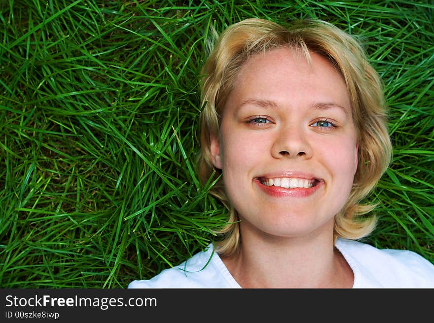 Woman lie on green grass. Woman lie on green grass