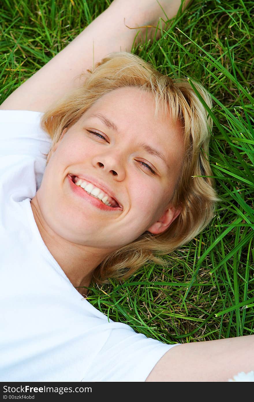 Woman lie on green grass. Woman lie on green grass