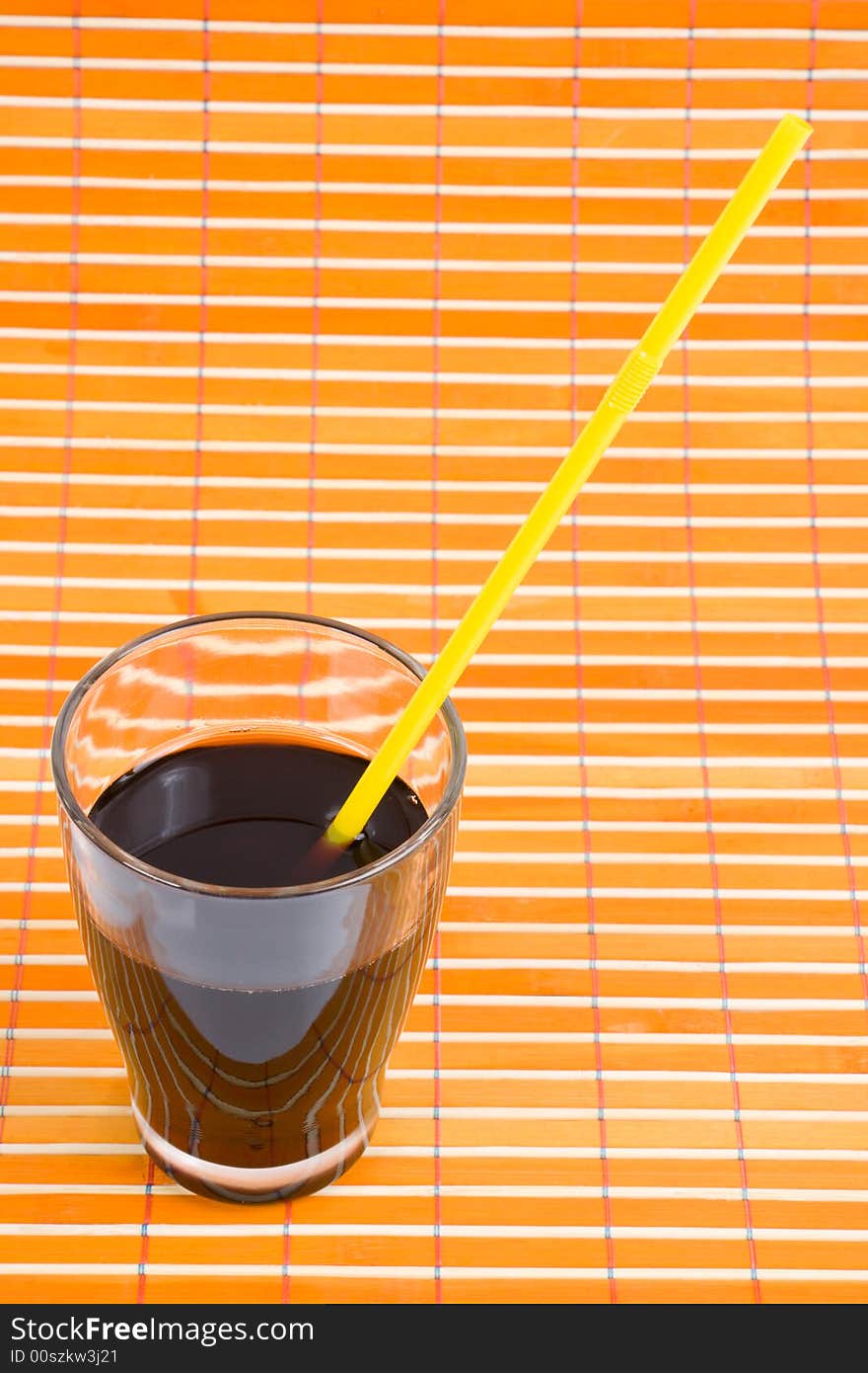 Fresh drink in glass with drinking straw