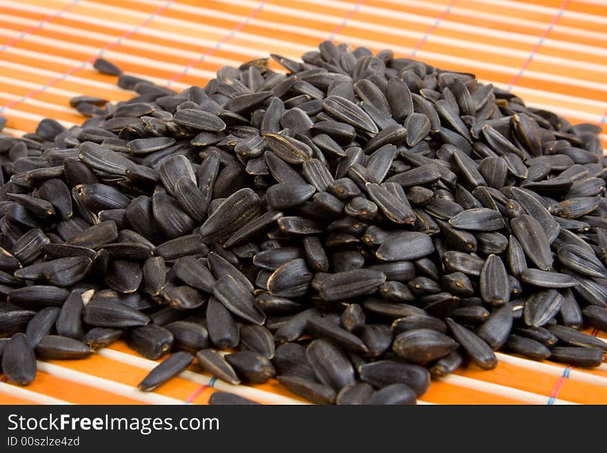 Close-up of sunflower seed on bamboo table-cloth