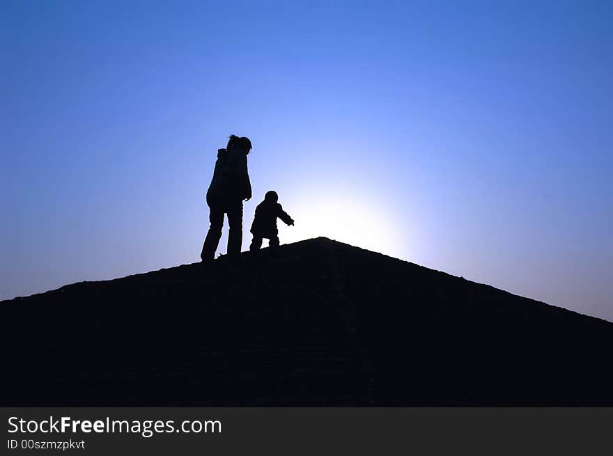 Silhouette of mother with baby